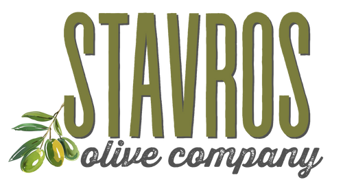 Logo of Stavros Olive Company with green text and olive branch on a white background